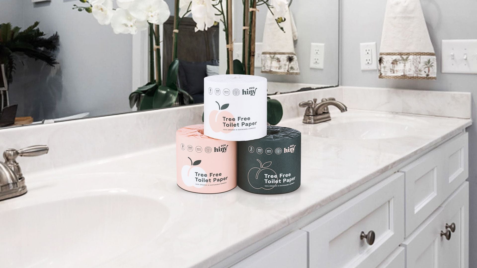 ecoHiny tree-free bamboo toilet paper rolls in eco-conscious packaging displayed on a bathroom countertop