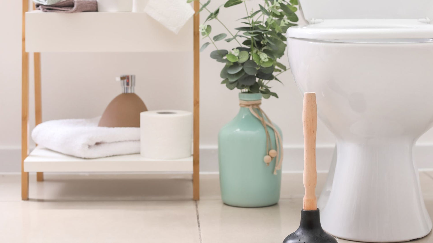 Bathroom scene with white toilet, wooden-handled plunger, and natural elements promoting sustainable toilet habits